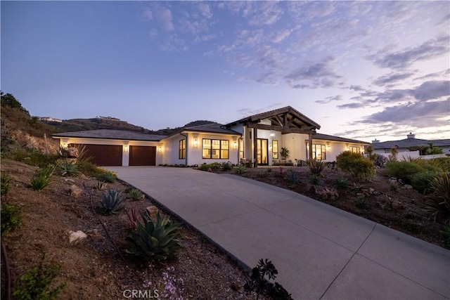 3325 Sagewood Hills Rd, Vista, CA 92084 - view of front of house featuring driveway, a garage, and stucco siding
