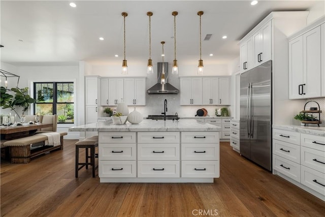 3325 Sagewood Hills Rd, Vista, CA 92084 - kitchen featuring stainless steel built in fridge, wall chimney exhaust hood, tasteful backsplash, white cabinets, and recessed lighting