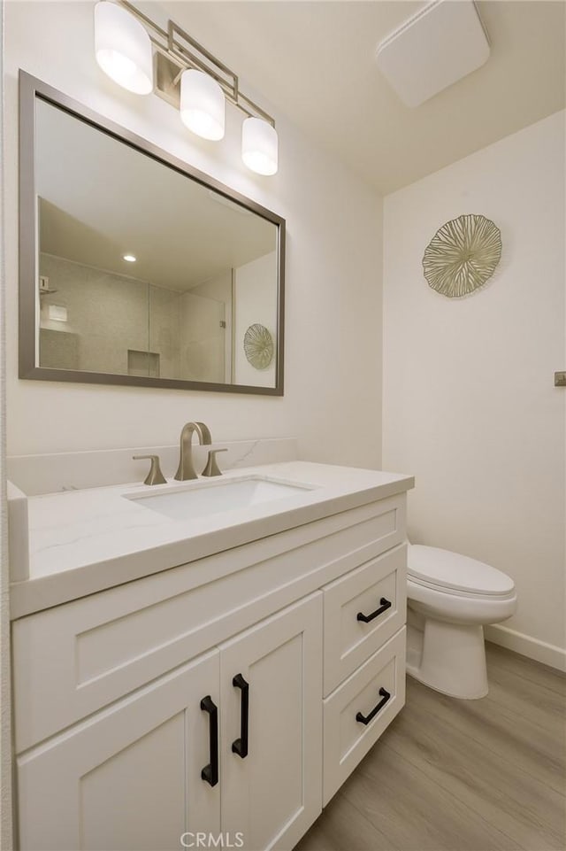 8645 Butte Cir Unit 603C, Huntington Beach, CA 92646 - bathroom featuring vanity and wood finished floors