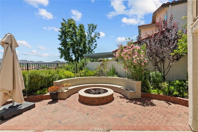 808 Links View Dr, Simi Valley, CA 93065 - fenced backyard with a patio area, a fire pit, and a mountain view