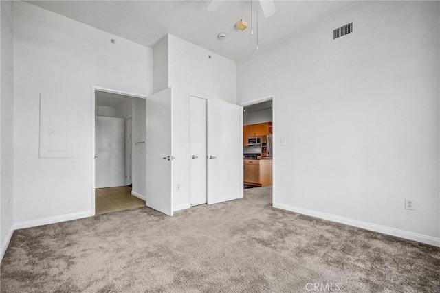 388 E Ocean Blvd Unit 1215, Long Beach, CA 90802 - unfurnished bedroom with carpet, a closet, a ceiling fan, and electric panel