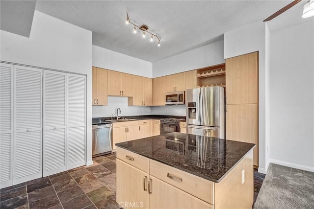 388 E Ocean Blvd Unit 1215, Long Beach, CA 90802 - kitchen with appliances with stainless steel finishes, light brown cabinetry, open shelves, dark stone counters, and dark stone finish floors