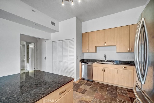 388 E Ocean Blvd Unit 1215, Long Beach, CA 90802 - kitchen with stainless steel appliances, light brown cabinets, dark stone countertops, and dark stone finish floors