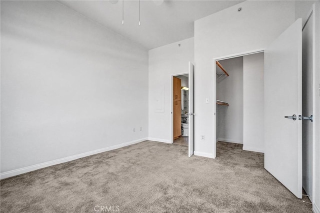388 E Ocean Blvd Unit 1215, Long Beach, CA 90802 - unfurnished bedroom featuring carpet floors, lofted ceiling, a spacious closet, and ceiling fan