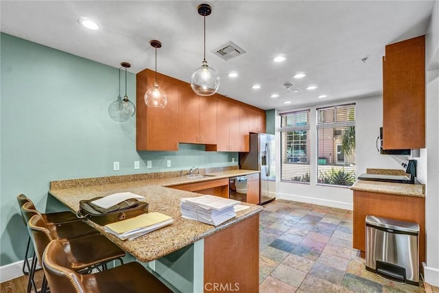 388 E Ocean Blvd Unit 1215, Long Beach, CA 90802 - kitchen featuring stainless steel refrigerator with ice dispenser, dishwashing machine, recessed lighting, a peninsula, and a breakfast bar