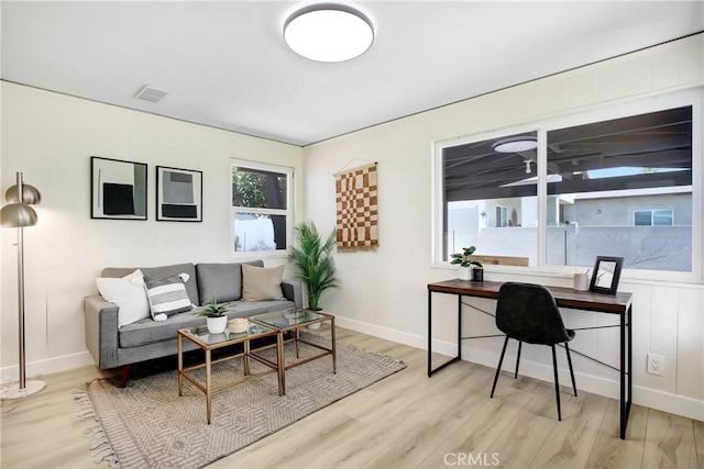293 E Congress St, Colton, CA 92324 - living room with wood finished floors and a desk
