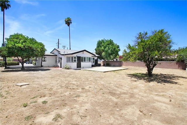 293 E Congress St, Colton, CA 92324 - rear view of house featuring a patio, a fenced backyard, and stucco siding