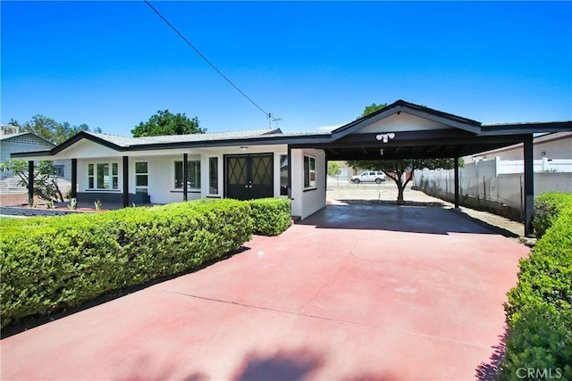 293 E Congress St, Colton, CA 92324 - single story home featuring concrete driveway, stucco siding, and a carport