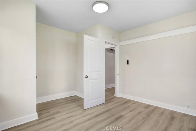 293 E Congress St, Colton, CA 92324 - unfurnished room with light wood-style flooring and baseboards