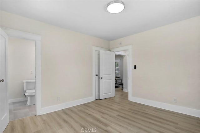 293 E Congress St, Colton, CA 92324 - unfurnished bedroom with light wood-style floors and baseboards