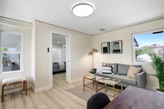 293 E Congress St, Colton, CA 92324 - living room featuring light wood-type flooring and baseboards
