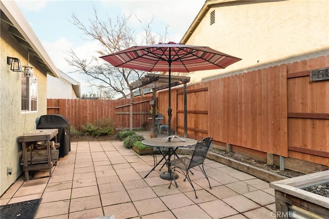 1101 Admiral Ln, Chico, CA 95973 - fenced backyard with a patio, a grill, and outdoor dining area