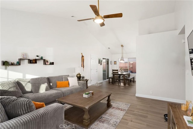 1101 Admiral Ln, Chico, CA 95973 - living room featuring ceiling fan, high vaulted ceiling, and wood finished floors
