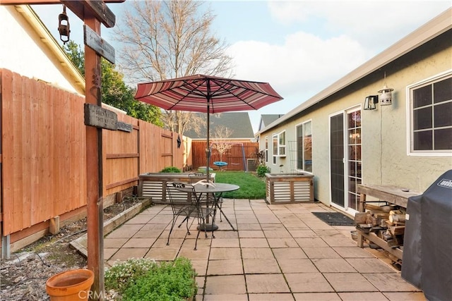 1101 Admiral Ln, Chico, CA 95973 - fenced backyard featuring a patio area, area for grilling, and outdoor dining area