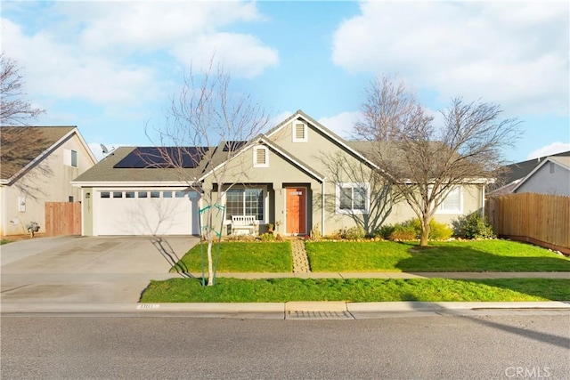 1101 Admiral Ln, Chico, CA 95973 - view of front facade featuring concrete driveway, stucco siding, an attached garage, and solar panels