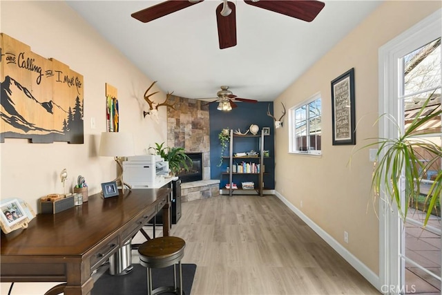 1101 Admiral Ln, Chico, CA 95973 - office featuring a ceiling fan, light wood-style flooring, and a fireplace