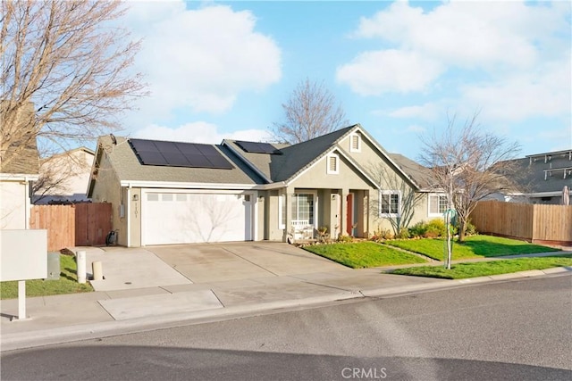 1101 Admiral Ln, Chico, CA 95973 - single story home with stucco siding, an attached garage, solar panels, and concrete driveway