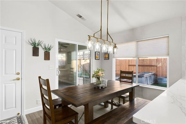 1101 Admiral Ln, Chico, CA 95973 - dining space featuring lofted ceiling and dark wood-type flooring