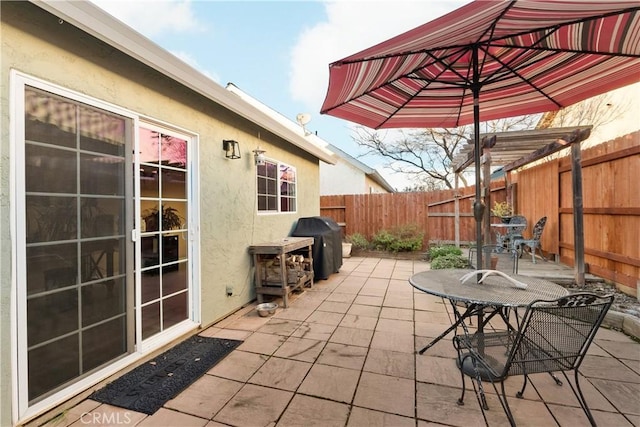 1101 Admiral Ln, Chico, CA 95973 - fenced backyard featuring a patio area and area for grilling