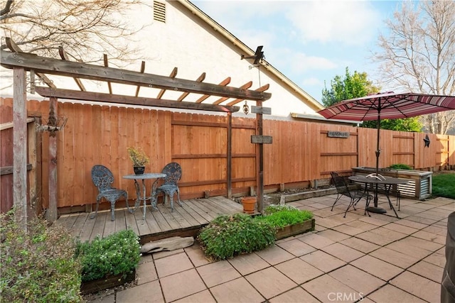 1101 Admiral Ln, Chico, CA 95973 - fenced backyard with a patio, a deck, and outdoor dining space
