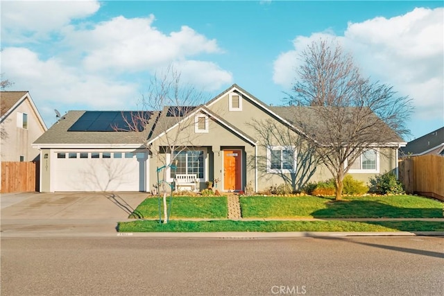 1101 Admiral Ln, Chico, CA 95973 - view of front facade with stucco siding, driveway, roof mounted solar panels, and an attached garage