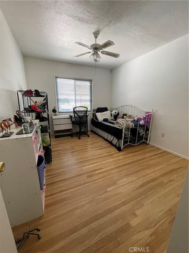 7957 Sausalito Ave, West Hills, CA 91304 - bedroom featuring light wood-type flooring, a textured ceiling, and a ceiling fan
