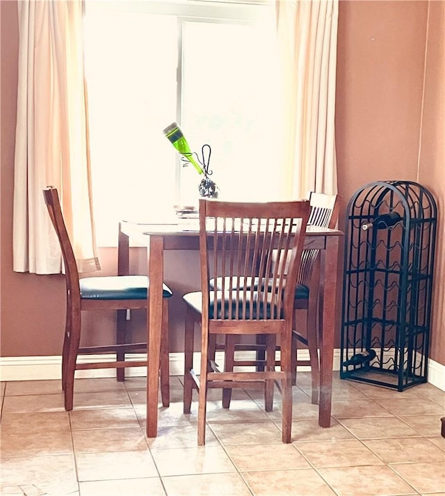7957 Sausalito Ave, West Hills, CA 91304 - dining space with tile patterned floors and baseboards