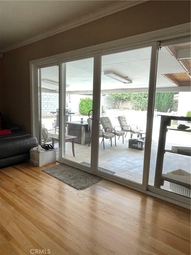 7957 Sausalito Ave, West Hills, CA 91304 - entryway featuring wood finished floors, ornamental molding, and healthy amount of natural light