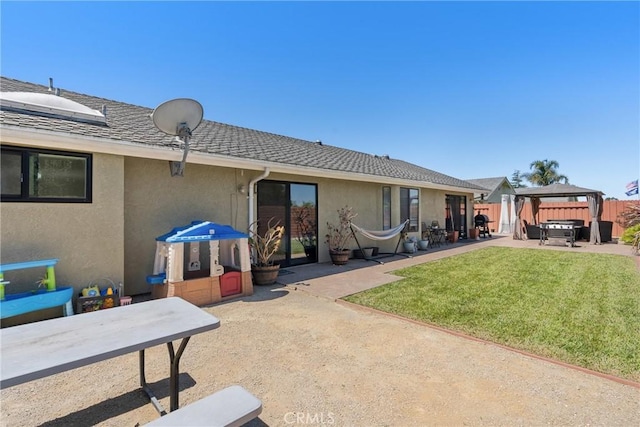 1269 Country Hill Rd, Santa Maria, CA 93455 - back of property featuring a jacuzzi, a patio area, stucco siding, and a gazebo