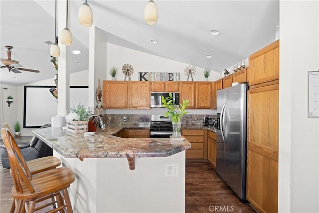 1269 Country Hill Rd, Santa Maria, CA 93455 - kitchen with appliances with stainless steel finishes, vaulted ceiling, a peninsula, a kitchen breakfast bar, and a ceiling fan