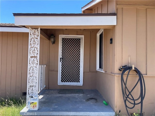 13213 Leffingwell Rd, Whittier, CA 90605 - view of exterior entry featuring board and batten siding