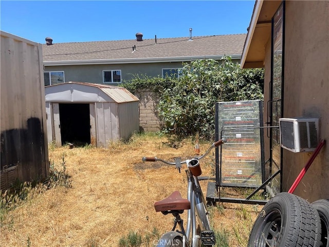13213 Leffingwell Rd, Whittier, CA 90605 - view of yard with a storage unit and an AC wall unit