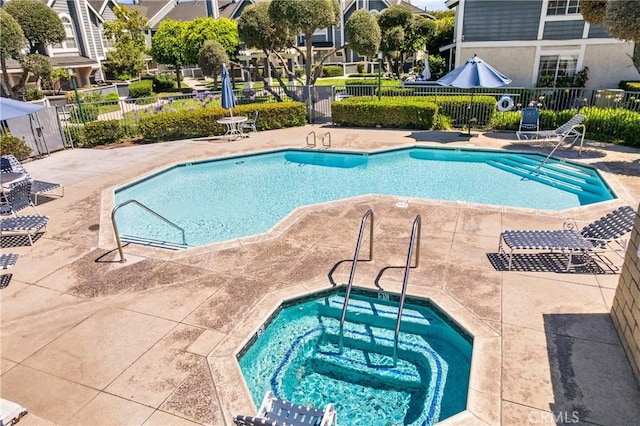 12277 Foster Rd, Norwalk, CA 90650 - community pool featuring a community hot tub and a patio