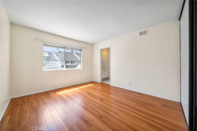 12277 Foster Rd, Norwalk, CA 90650 - unfurnished room with wood finished floors and baseboards
