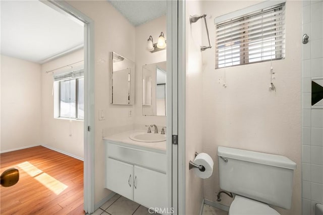 12277 Foster Rd, Norwalk, CA 90650 - bathroom with vanity and wood finished floors