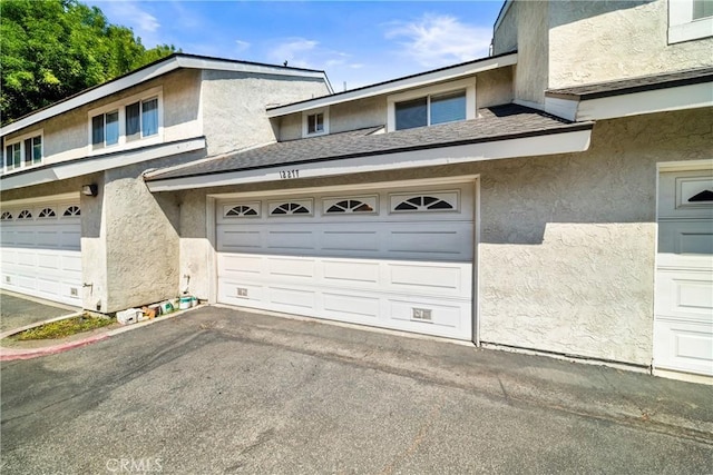 12277 Foster Rd, Norwalk, CA 90650 - garage featuring asphalt driveway
