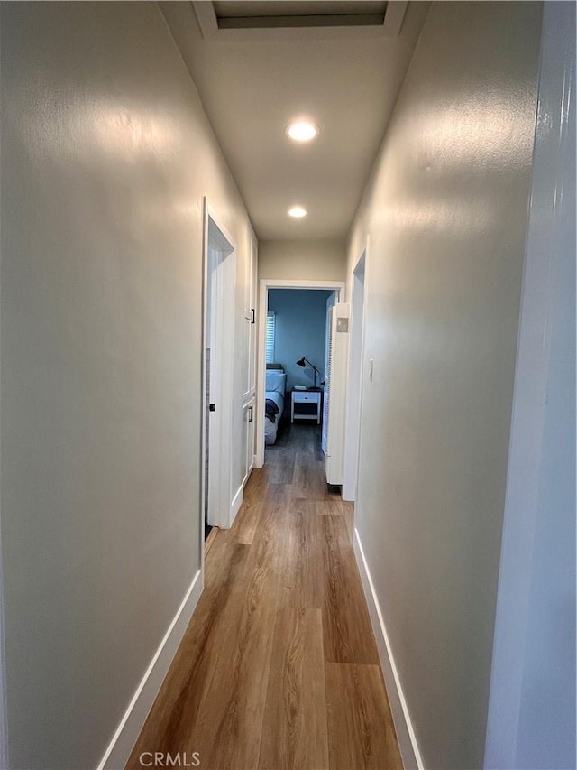 1610 266th St, Harbor City, CA 90710 - hallway with wood finished floors, recessed lighting, and attic access