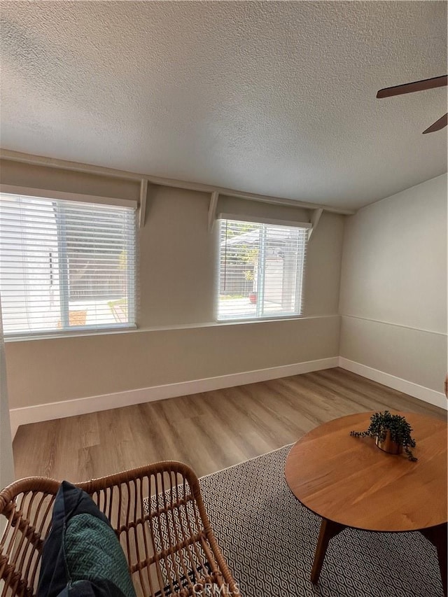 1610 266th St, Harbor City, CA 90710 - living area featuring a textured ceiling, wood finished floors, and ceiling fan
