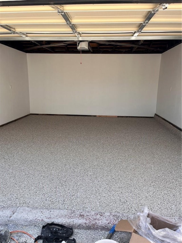 1610 266th St, Harbor City, CA 90710 - garage featuring a garage door opener and baseboards