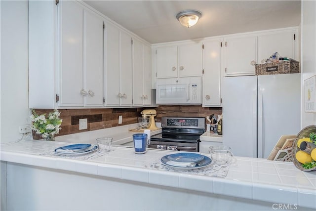 4900 E Chapman Ave Unit 24, Orange, CA 92869 - kitchen with white appliances, decorative backsplash, and white cabinetry