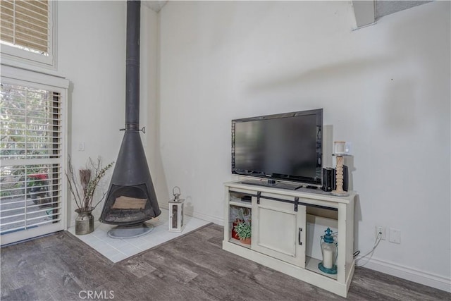 4900 E Chapman Ave Unit 24, Orange, CA 92869 - living area featuring a wood stove and wood finished floors