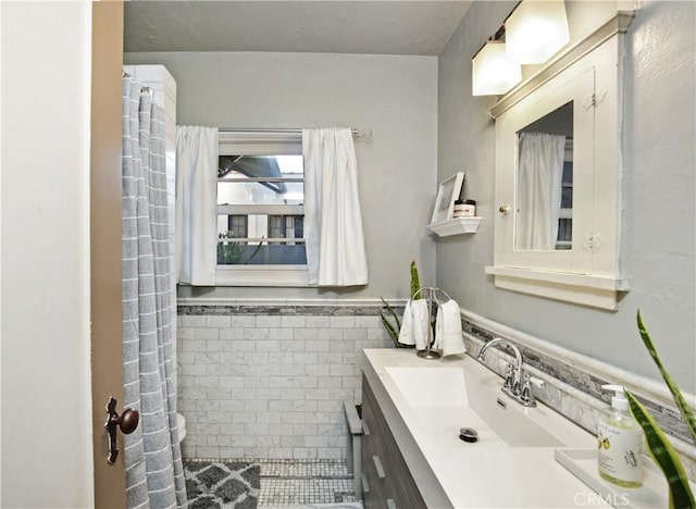404 N Vinedo Ave, Pasadena, CA 91107 - bathroom with vanity, a wainscoted wall, and tile walls