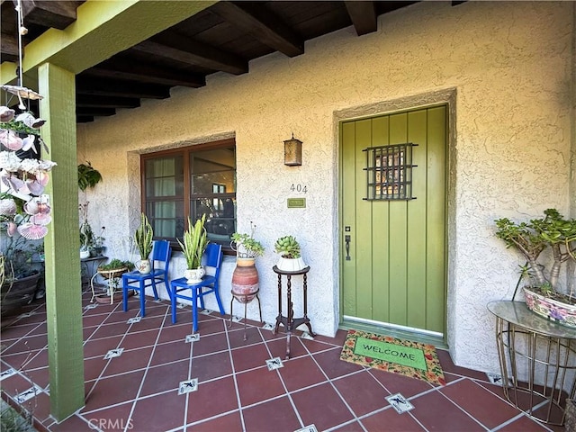 404 N Vinedo Ave, Pasadena, CA 91107 - doorway to property featuring stucco siding and covered porch