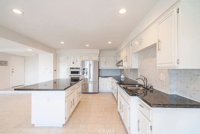 2209 W 25th St Unit 7, San Pedro, CA 90732 - kitchen with stainless steel fridge, under cabinet range hood, a center island, recessed lighting, and tasteful backsplash