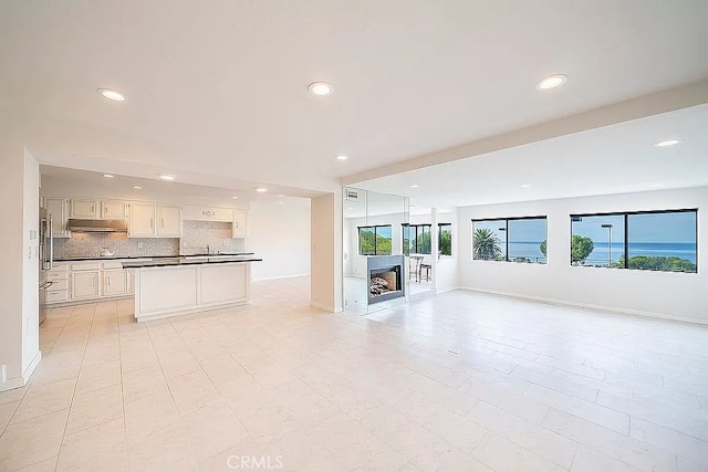 2209 W 25th St Unit 7, San Pedro, CA 90732 - unfurnished living room with recessed lighting and a fireplace
