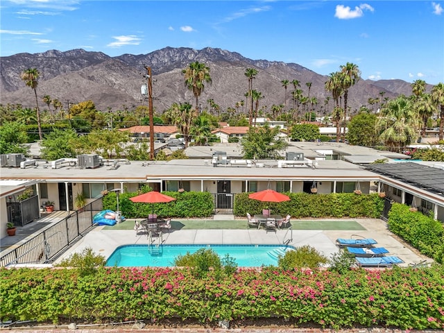 579 S Highland Dr, Palm Springs, CA 92264 - community pool featuring a patio area, a mountain view, and a gate
