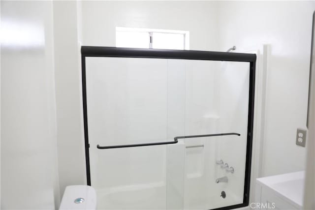 15154 Oliva Ave, Paramount, CA 90723 - bathroom featuring shower / bath combination with glass door and toilet