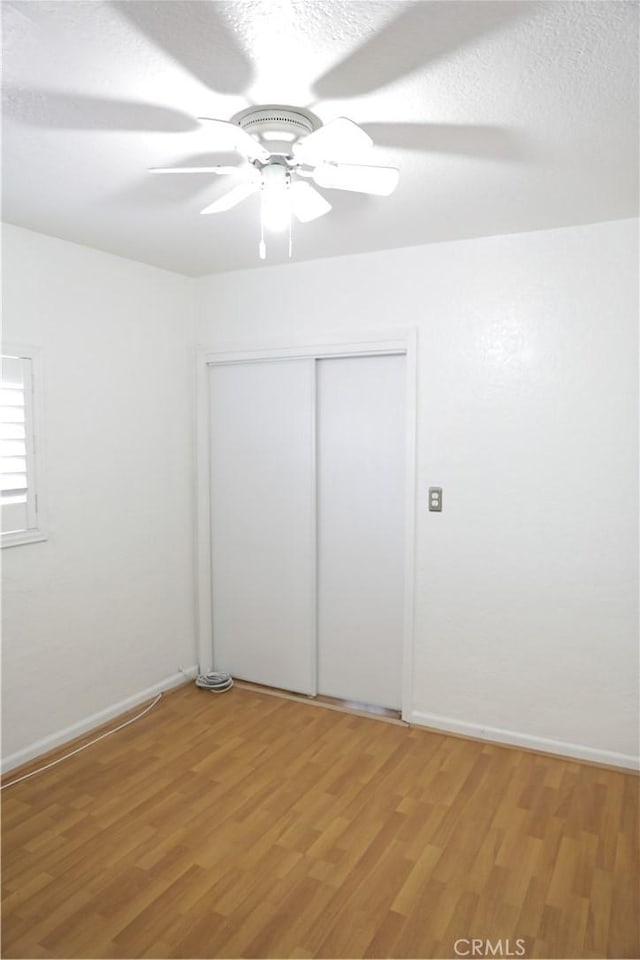 15154 Oliva Ave, Paramount, CA 90723 - unfurnished bedroom featuring light wood finished floors, a closet, and ceiling fan