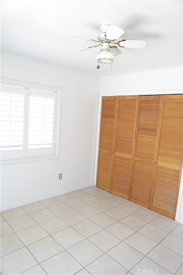 15154 Oliva Ave, Paramount, CA 90723 - unfurnished bedroom with a closet and ceiling fan