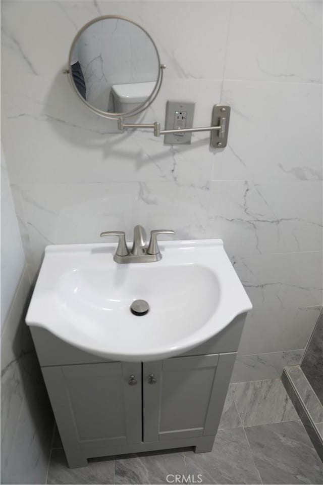 15154 Oliva Ave, Paramount, CA 90723 - bathroom featuring marble finish flooring and vanity